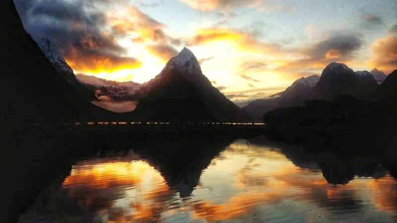 Mitre Peak in the evening light a sunset over a fire