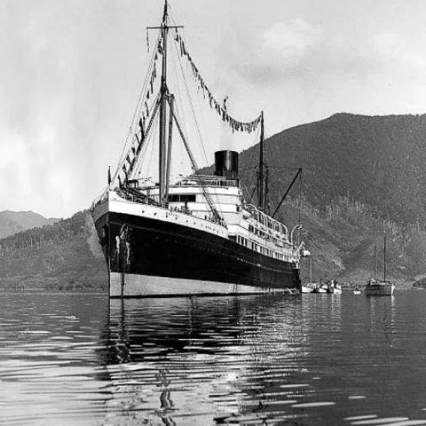 a small boat in a large body of water