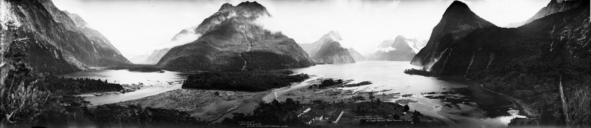 a waterfall with a mountain in the background
