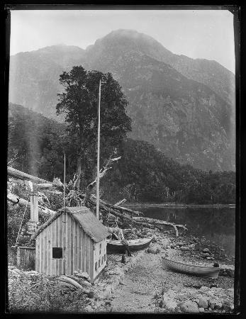 a view of an old building with a mountain in the background