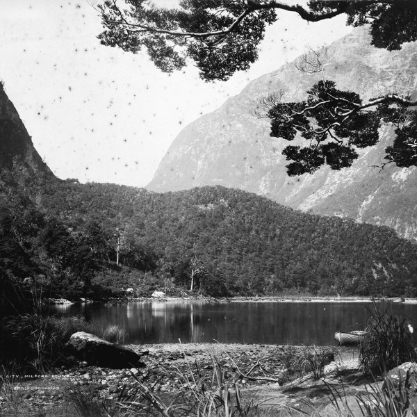 a body of water with a mountain in the background