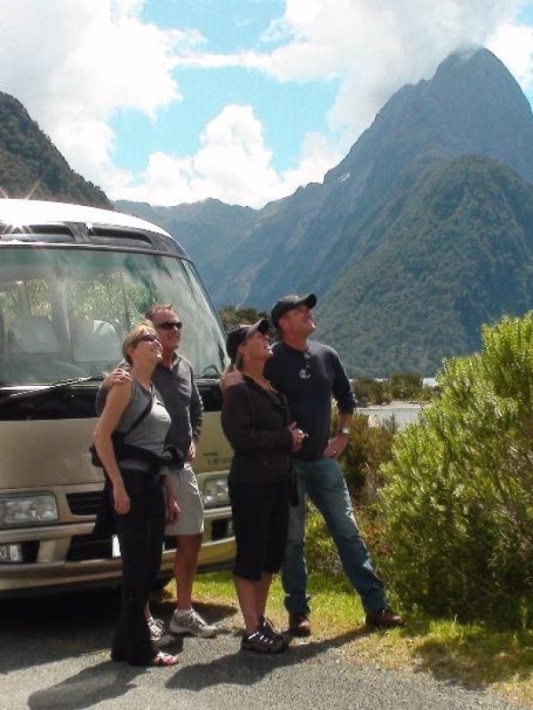 image1 a bus parked in front of a mountain