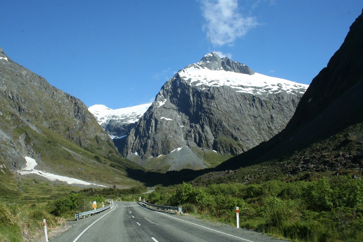 milford-Sound-By-Road a view of the side of a mountain road