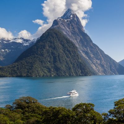 a body of water with a mountain in the background